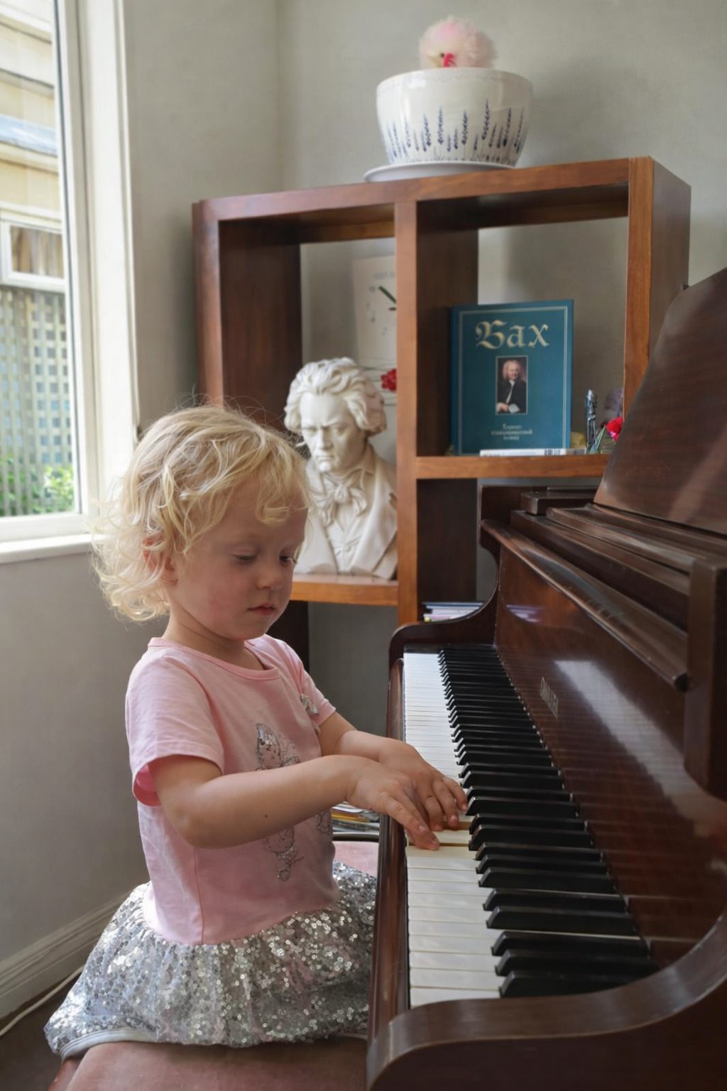 Little girl learning piano